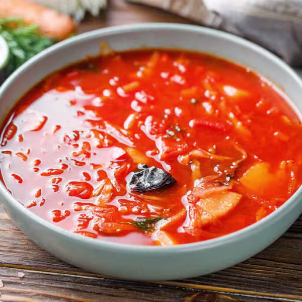 Traditional Ukrainian soup with beets, tomatoes, and pork ribs